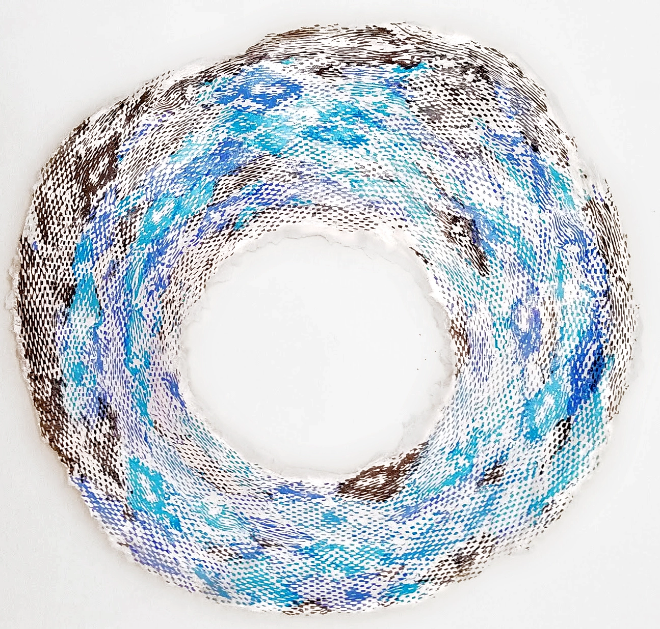 Dying Young Adult Universe 10.17.21 — a blue and brown screen-print collage ring, fraying at the edges.