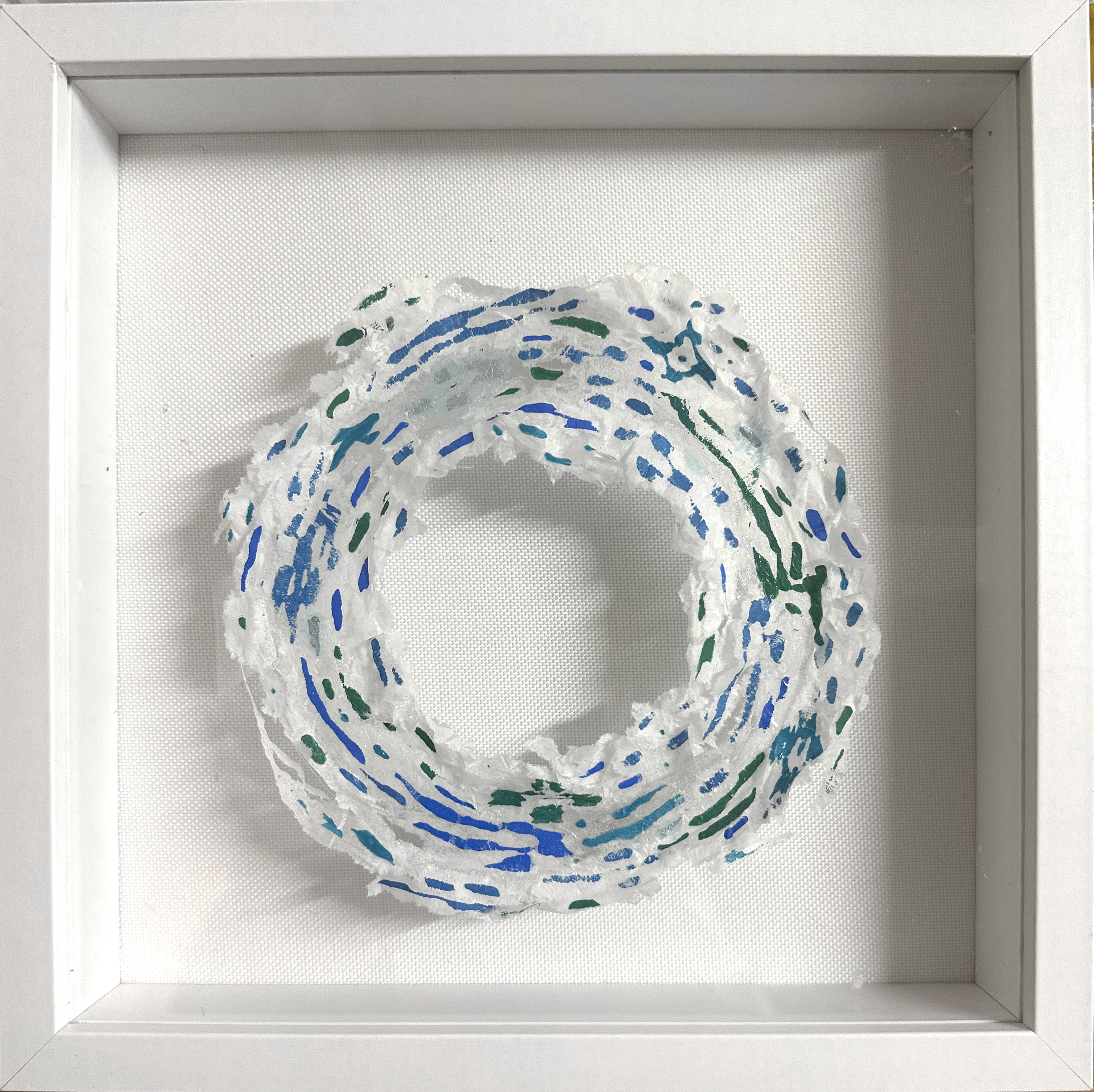 Proto Universe 06.21.26 — a small framed screen-print collage ring in blue and green.