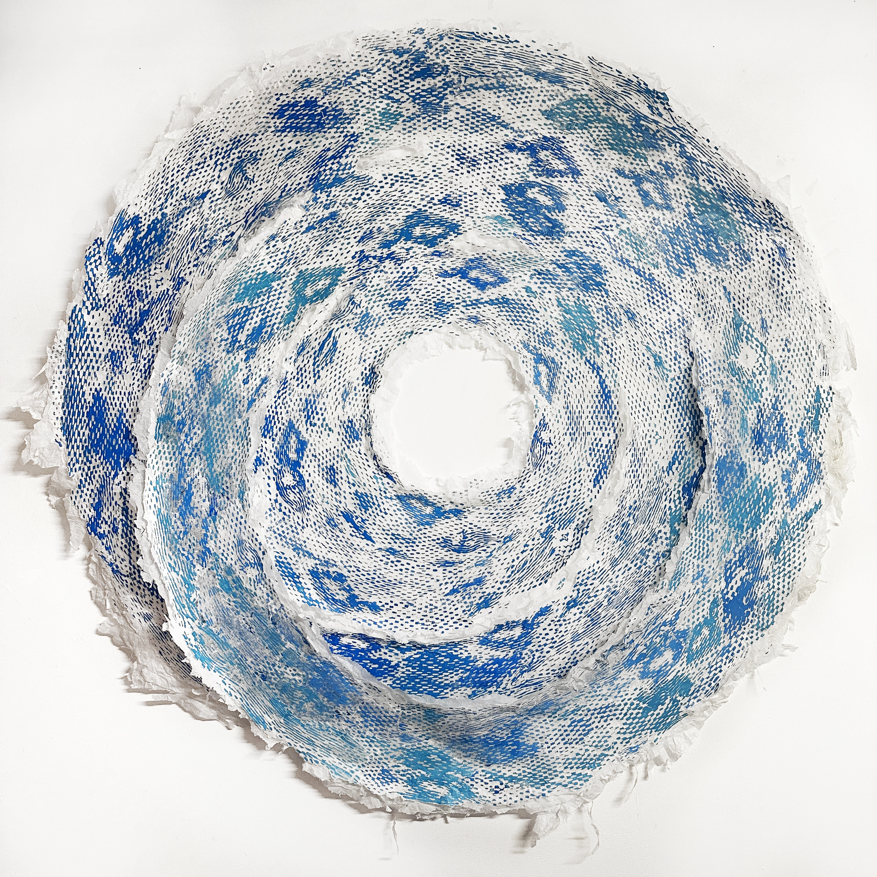 Uncoiling Mature Universe 08.23.25 — a cobalt-blue screen-print collage ring.